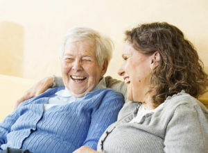 Client and caregiver laughing